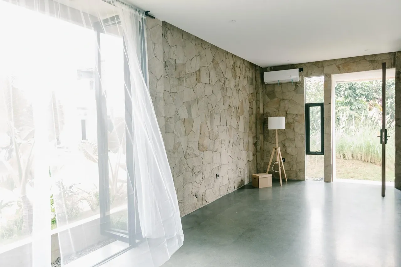 Rumasoka — natural stone living room opening to the courtyard